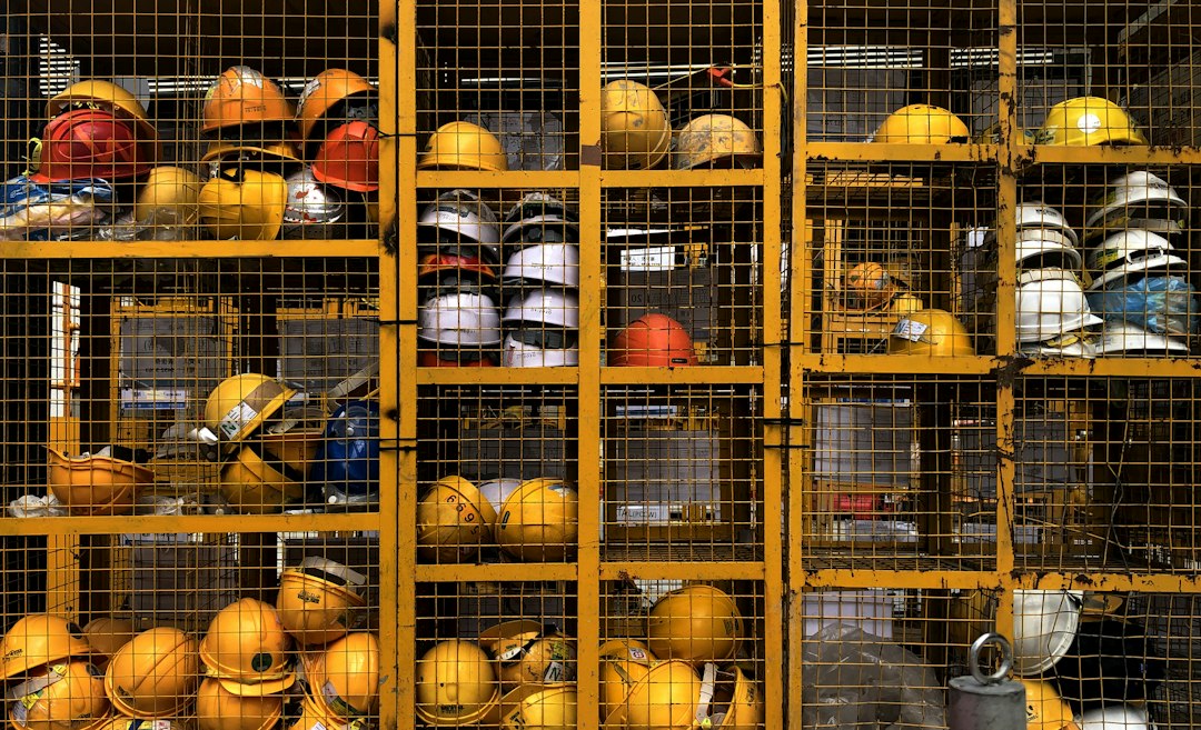 Construction helmets illustrating HSE jobs and workplace safety careers